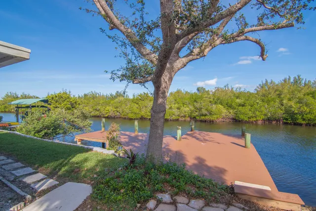 a view of a lake with houses in the back