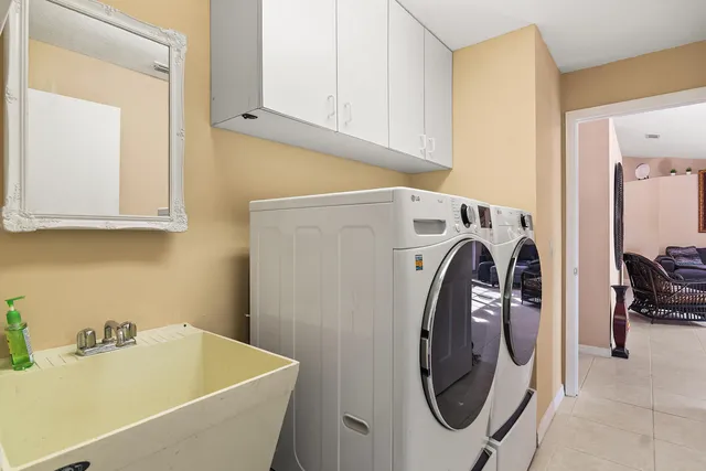 a utility room with dryer and washer