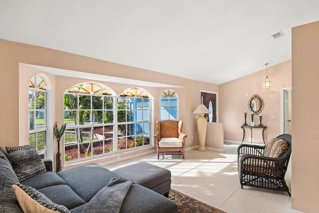a living room with furniture and a large window