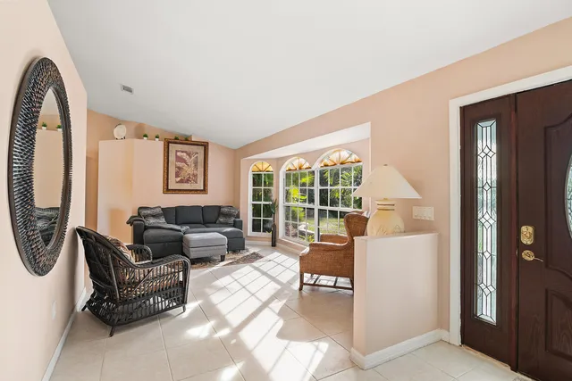 a living room with furniture and a window