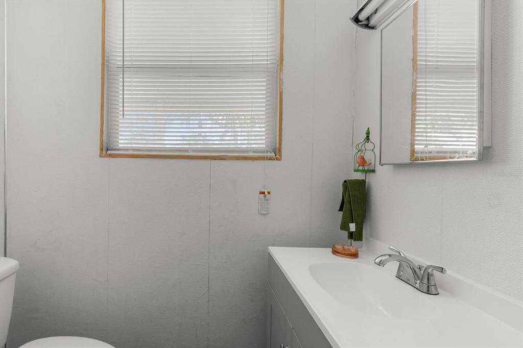 1226 South Telephone Point Road Inverness, FL 34450 - Photo 31 of 43 a bathroom with a sink and a window
