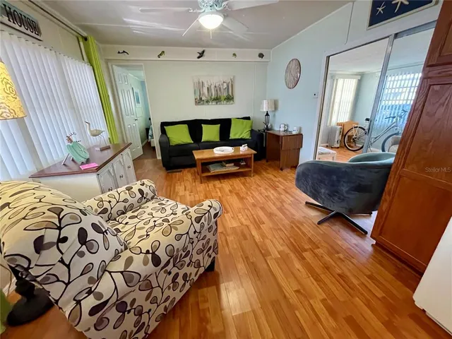 a bedroom with furniture and a window