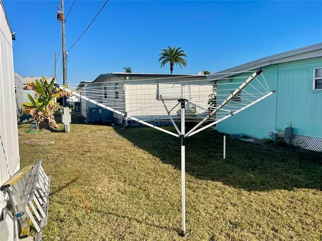 a patio with a table and chairs