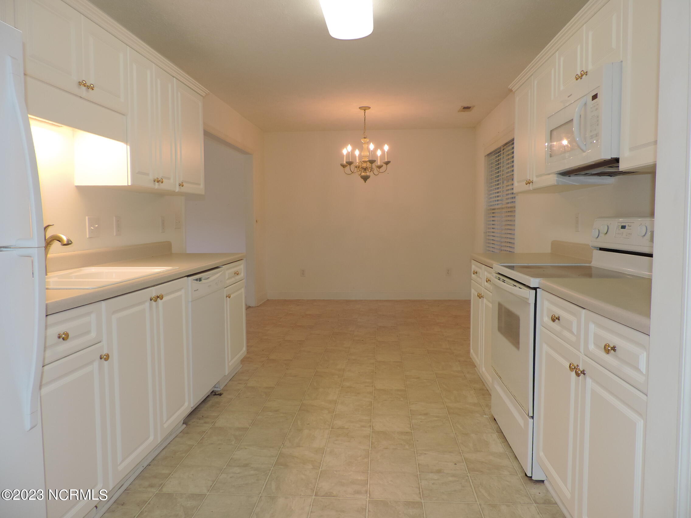 130 Hidden Pond Drive New Bern, NC 28562 - Photo 11 of 29 kitchen into dining room