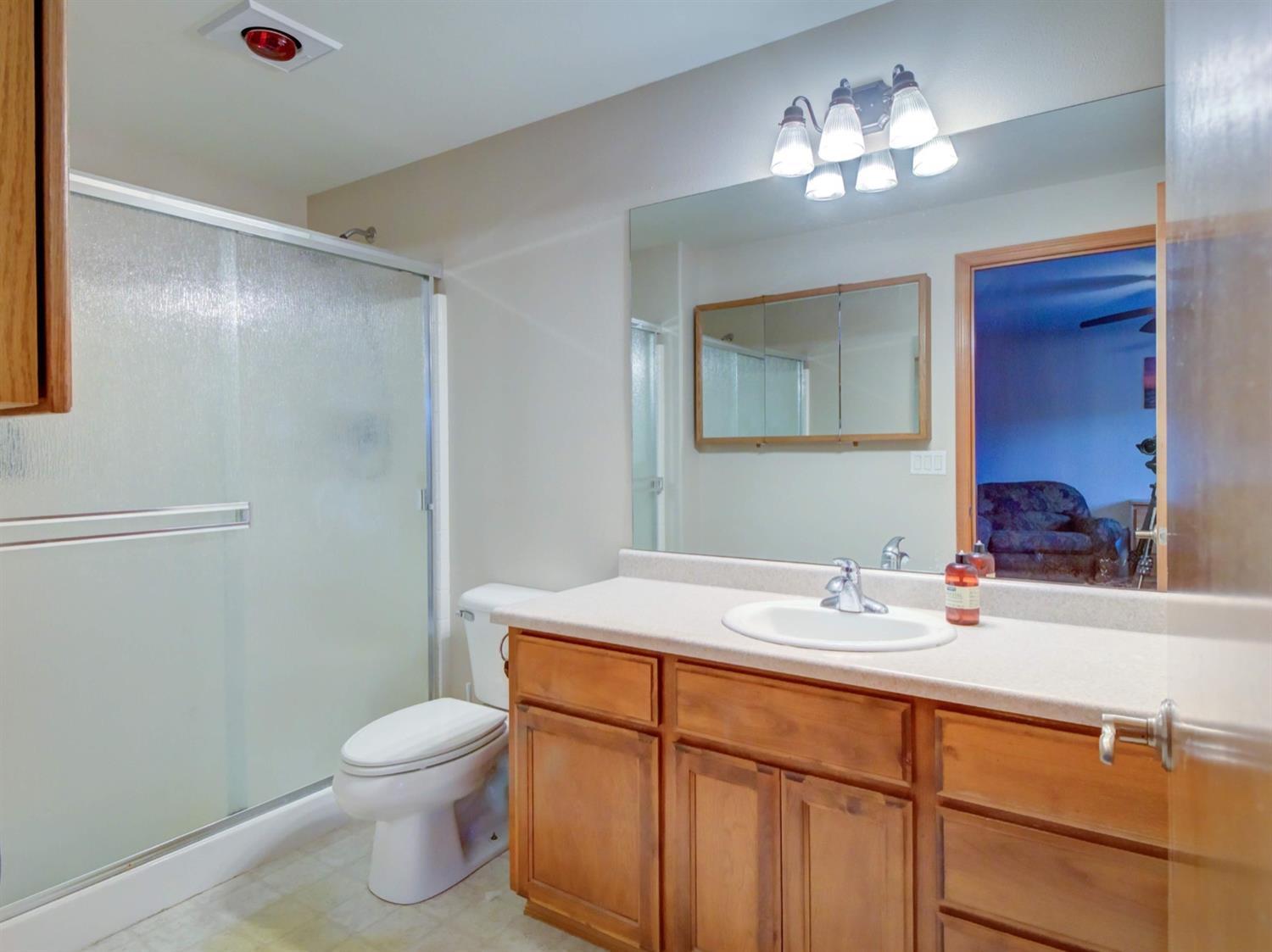 31 Woodcrest Circle Eagle Point, OR 97524 - Photo 9 of 17 a bathroom with a sink and a mirror