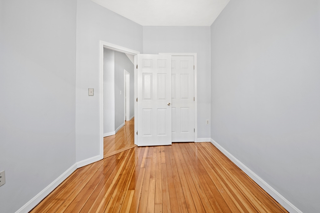 61 Shurtleff Street, Unit 4 Chelsea, MA 02150 - Photo 26 of 32 a view of a room with wooden floor and a window