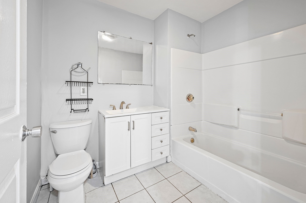 61 Shurtleff Street, Unit 4 Chelsea, MA 02150 - Photo 28 of 32 a bathroom with a sink toilet and bathtub