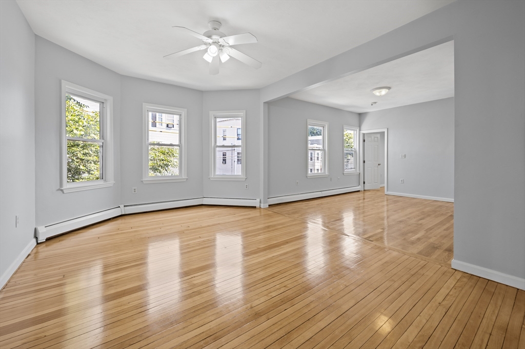 61 Shurtleff Street, Unit 4 Chelsea, MA 02150 - Photo 9 of 32 a view of empty room with wooden floor and fan