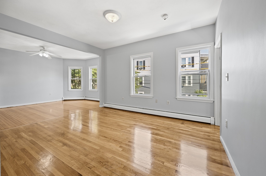 61 Shurtleff Street, Unit 4 Chelsea, MA 02150 - Photo 10 of 32 a view of empty room with wooden floor and fan