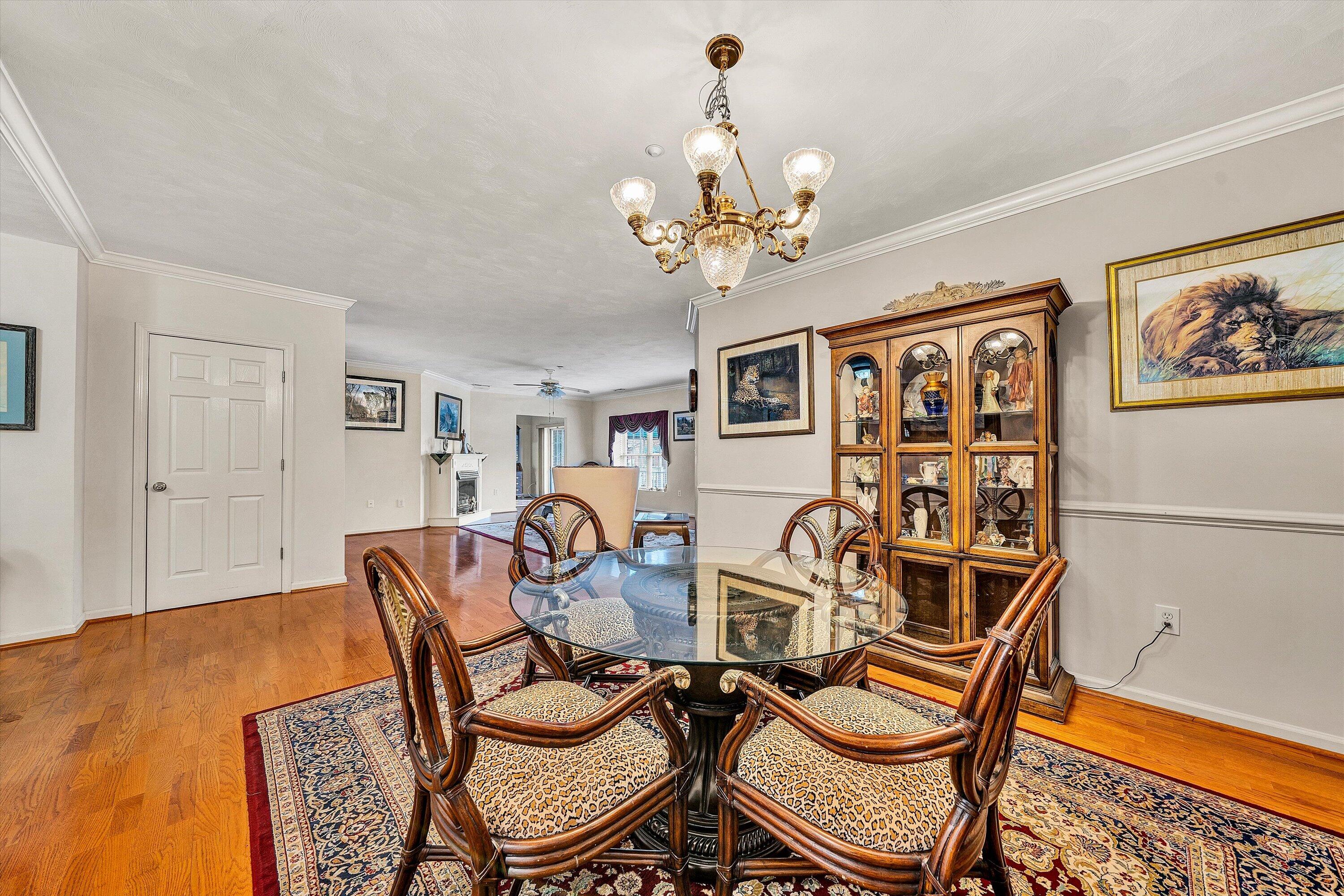 4434 Pheasant Ridge Road, Unit 101 Roanoke, VA 24014 - Photo 11 of 31 a view of a dining room with furniture and chandelier