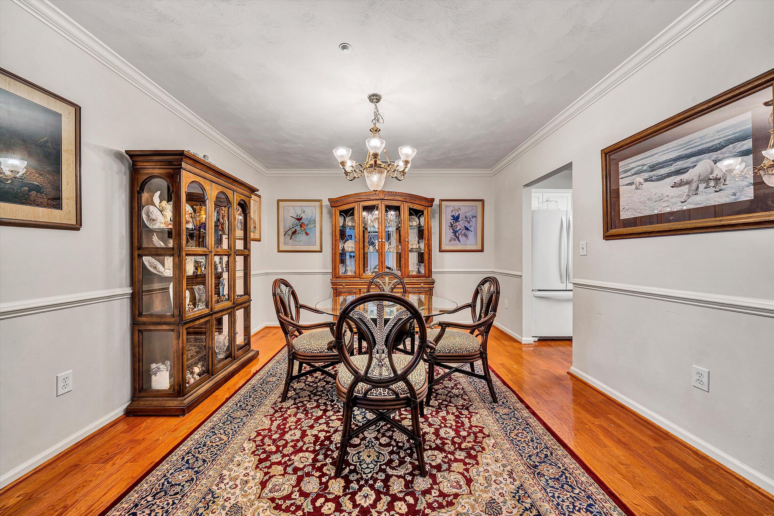 4434 Pheasant Ridge Road, Unit 101 Roanoke, VA 24014 - Photo 12 of 31 a view of a dining room with furniture a chandelier and wooden floor