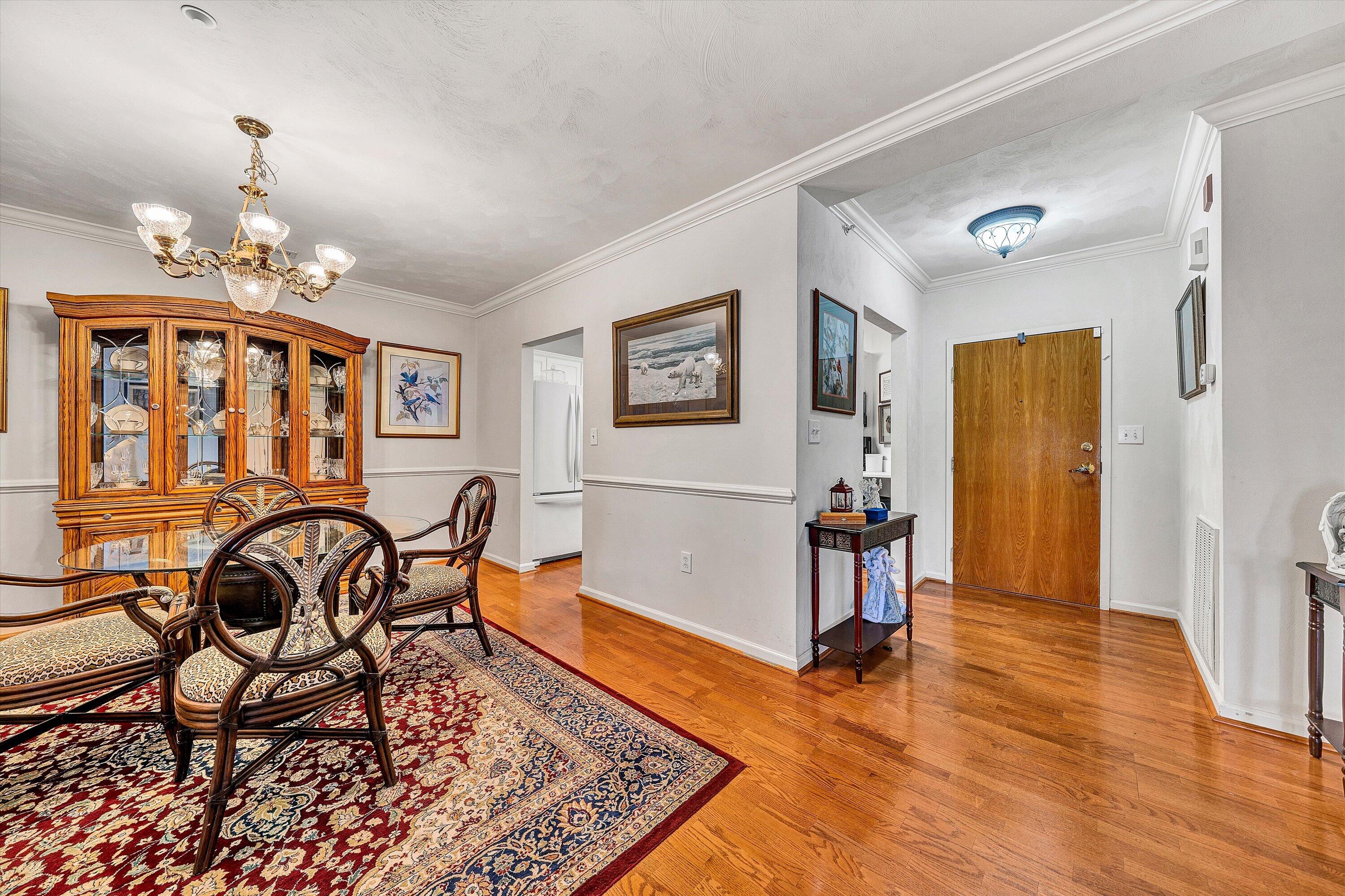 4434 Pheasant Ridge Road, Unit 101 Roanoke, VA 24014 - Photo 13 of 31 a view of a livingroom with furniture a dinning room and wooden floor