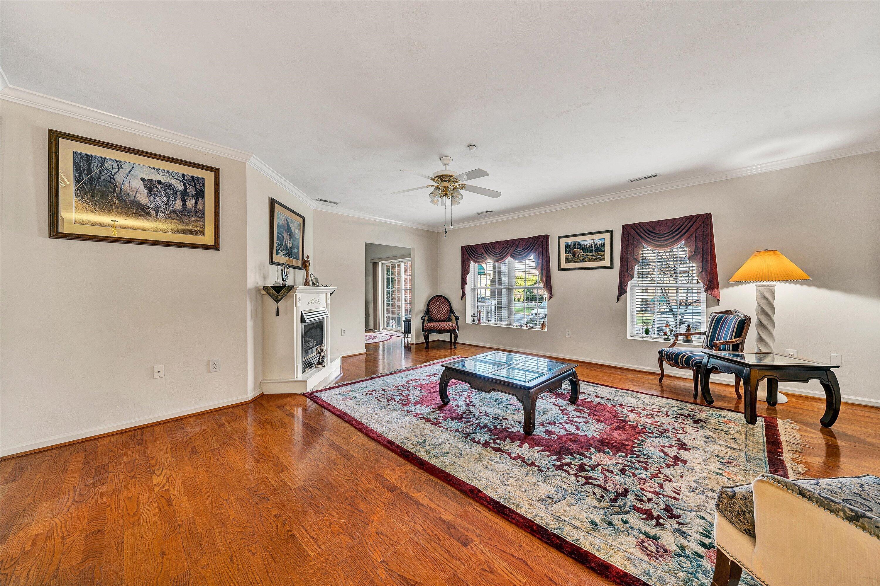 4434 Pheasant Ridge Road, Unit 101 Roanoke, VA 24014 - Photo 15 of 31 a living room with furniture and a wooden floor