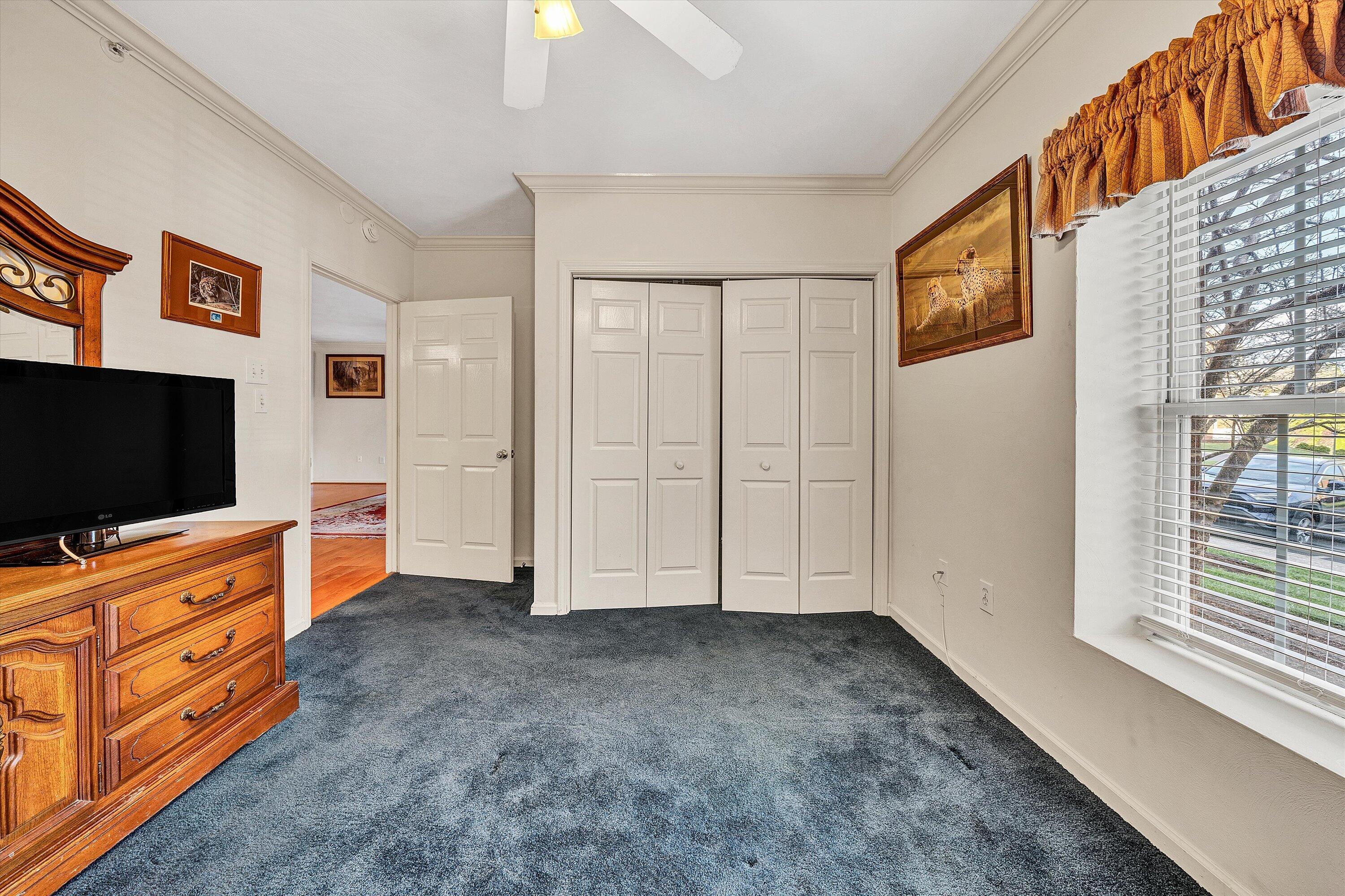 4434 Pheasant Ridge Road, Unit 101 Roanoke, VA 24014 - Photo 22 of 31 a view of room with cabinet flat screen tv and windows