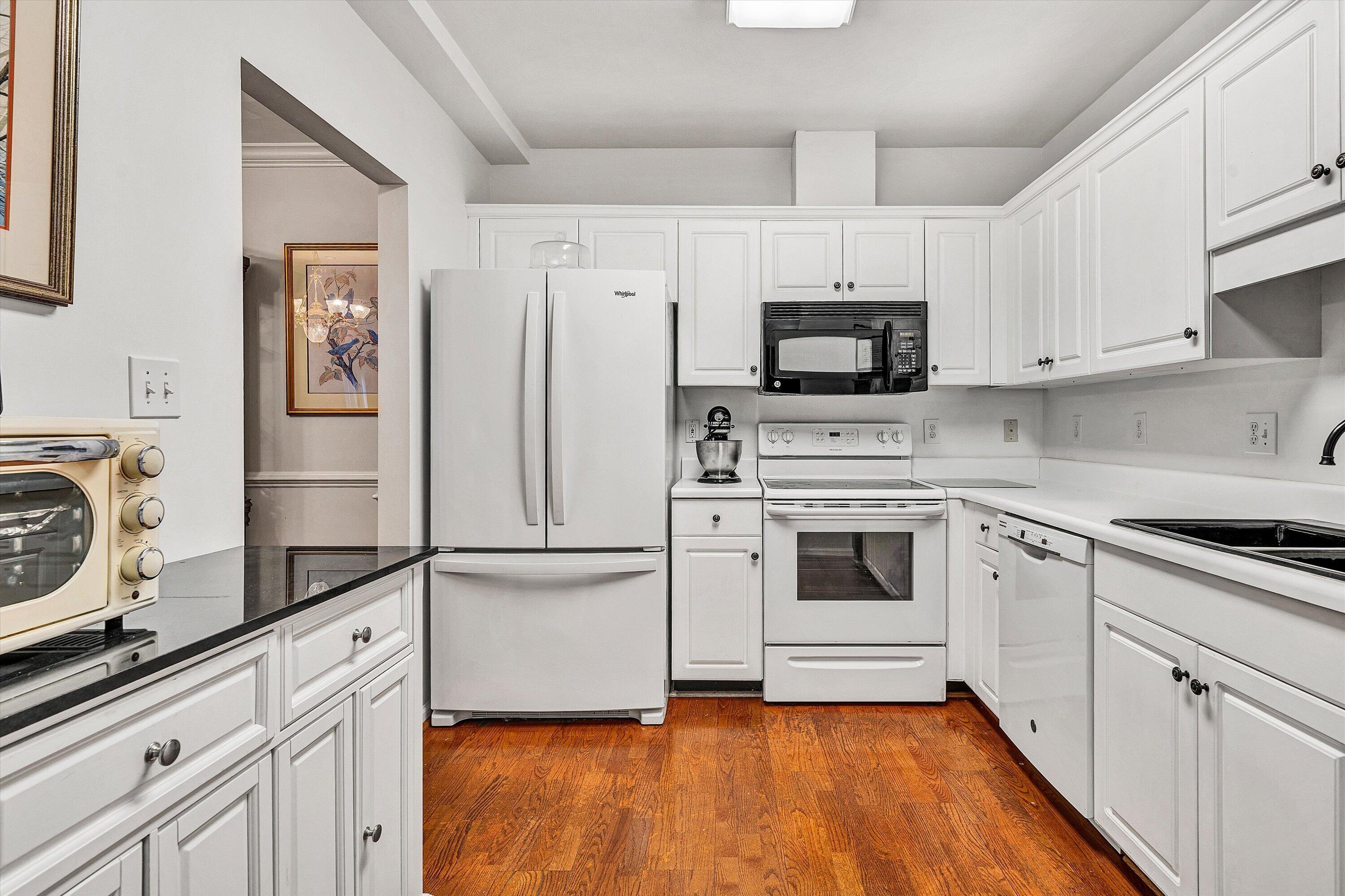 4434 Pheasant Ridge Road, Unit 101 Roanoke, VA 24014 - Photo 9 of 31 a kitchen with white cabinets and stainless steel appliances