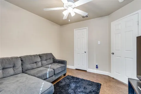 a living room with furniture and a rug