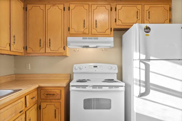 a view of a storage and utility room with washer and dryer