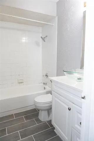 a bathroom with a sink a toilet and a bathtub