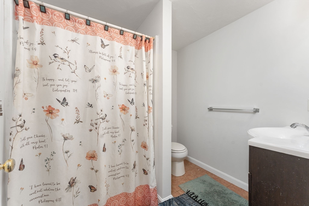 18 Edinboro Avenue Brockton, MA 02301 - Photo 11 of 28 a bathroom with a sink and toilet