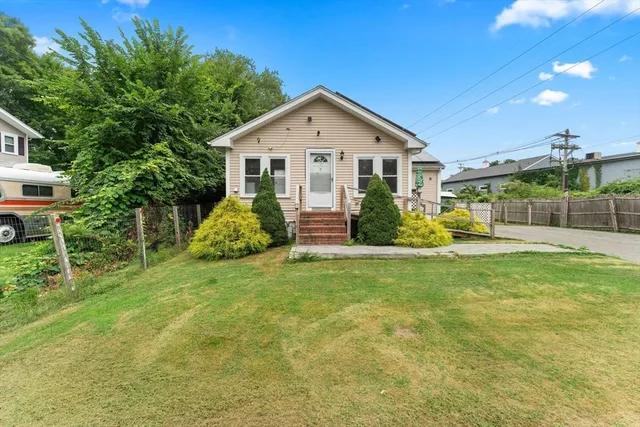a front view of a house with a yard