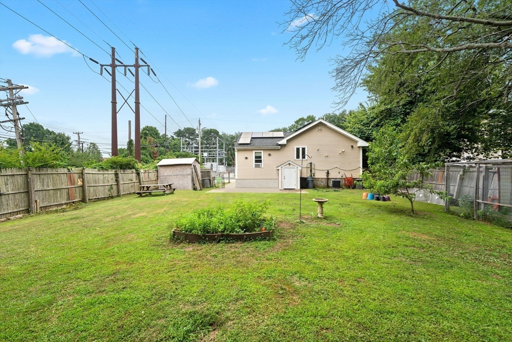 18 Edinboro Avenue Brockton, MA 02301 - Photo 13 of 28 a view of a house with backyard and a tree