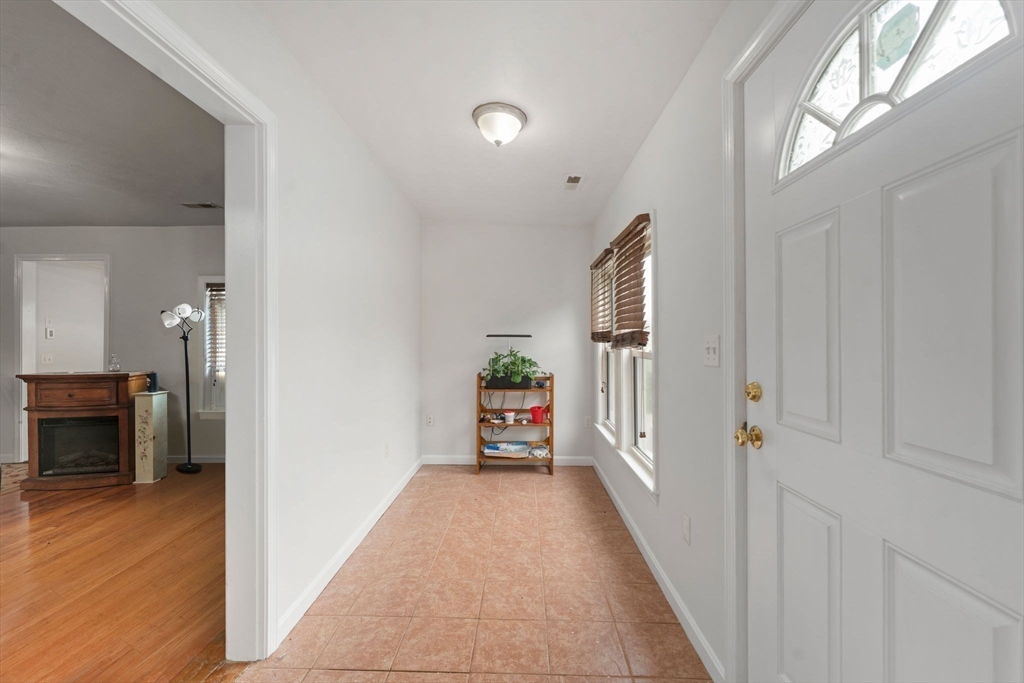 18 Edinboro Avenue Brockton, MA 02301 - Photo 23 of 28 a view of a hallway view with wooden floor and furniture