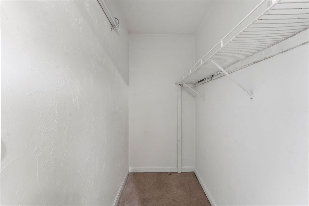 18 Edinboro Avenue Brockton, MA 02301 - Photo 25 of 28 a view of a room with racks on the wall