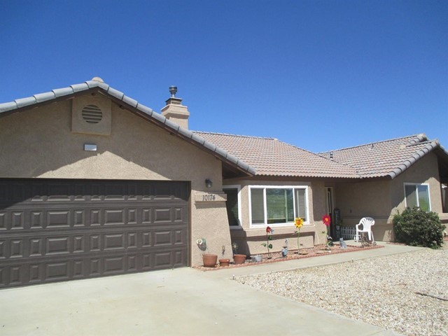 10174 Barker Road Oak Hills, CA 92344 - Photo 1 of 1 a view of a house with a patio