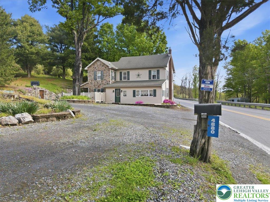 4880 Little Gap Road Kunkletown, PA 18058 - Photo 6 of 100 This inviting home features a charming exterior, nestled amidst mature trees with ample outdoor space.