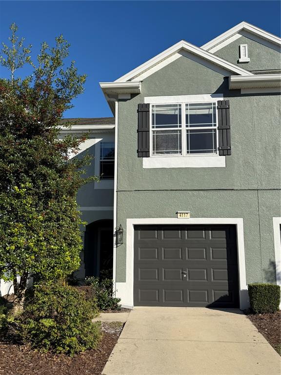 a front view of a house with a garage