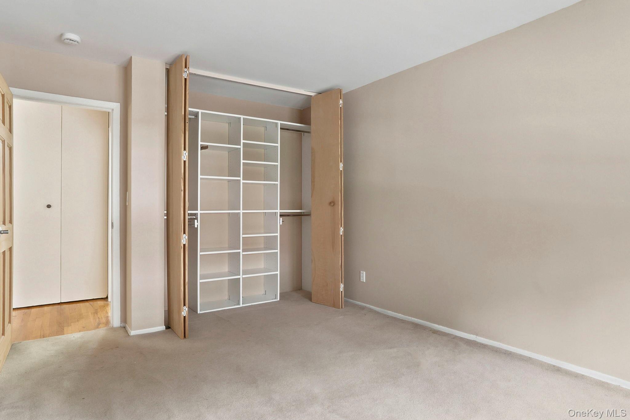 8 Colonial Road, Unit 36 Beacon, NY 12508 - Photo 14 of 20 A giant closet with built-ins is ready to organize your wardrobe. There's an additional closet in the hall outside the bath too.