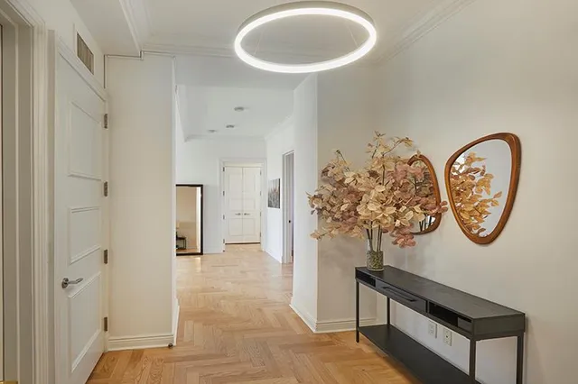 a bedroom with furniture and large windows