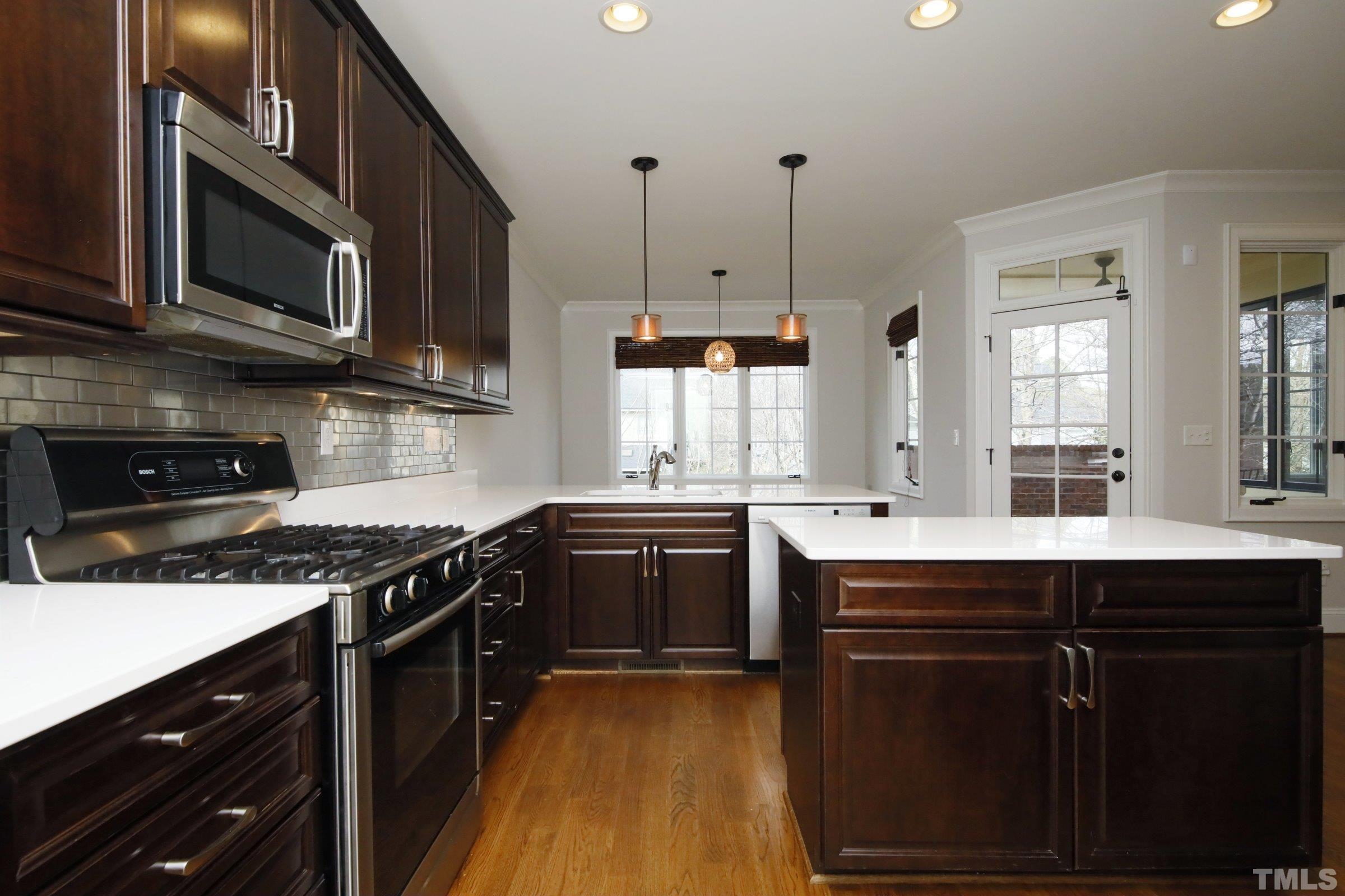 143 Cofield Circle Durham, NC 27707 - Photo 16 of 43 a kitchen with stainless steel appliances granite countertop a stove a sink dishwasher and a microwave