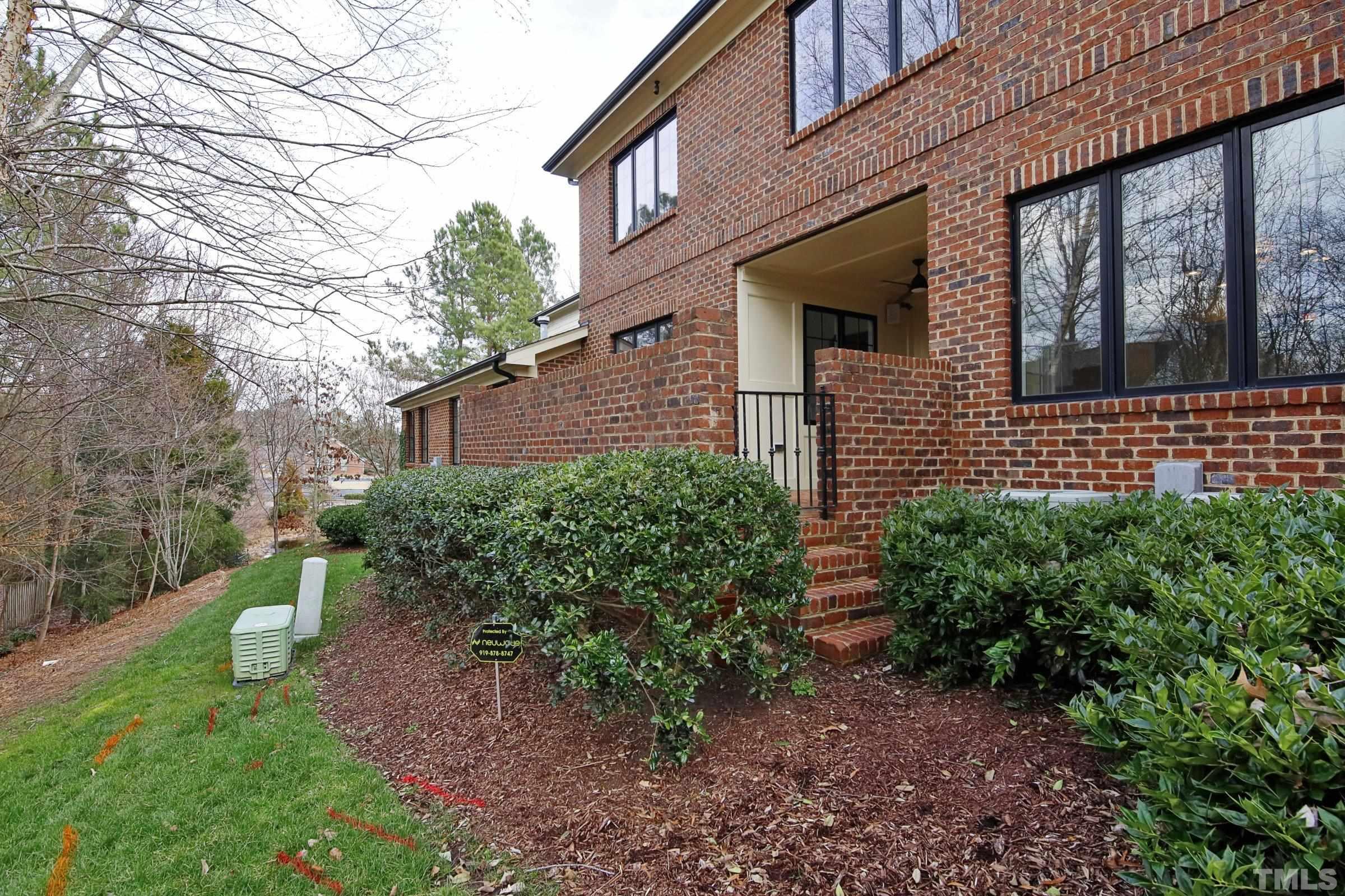 143 Cofield Circle Durham, NC 27707 - Photo 25 of 43 a front view of a house with garden