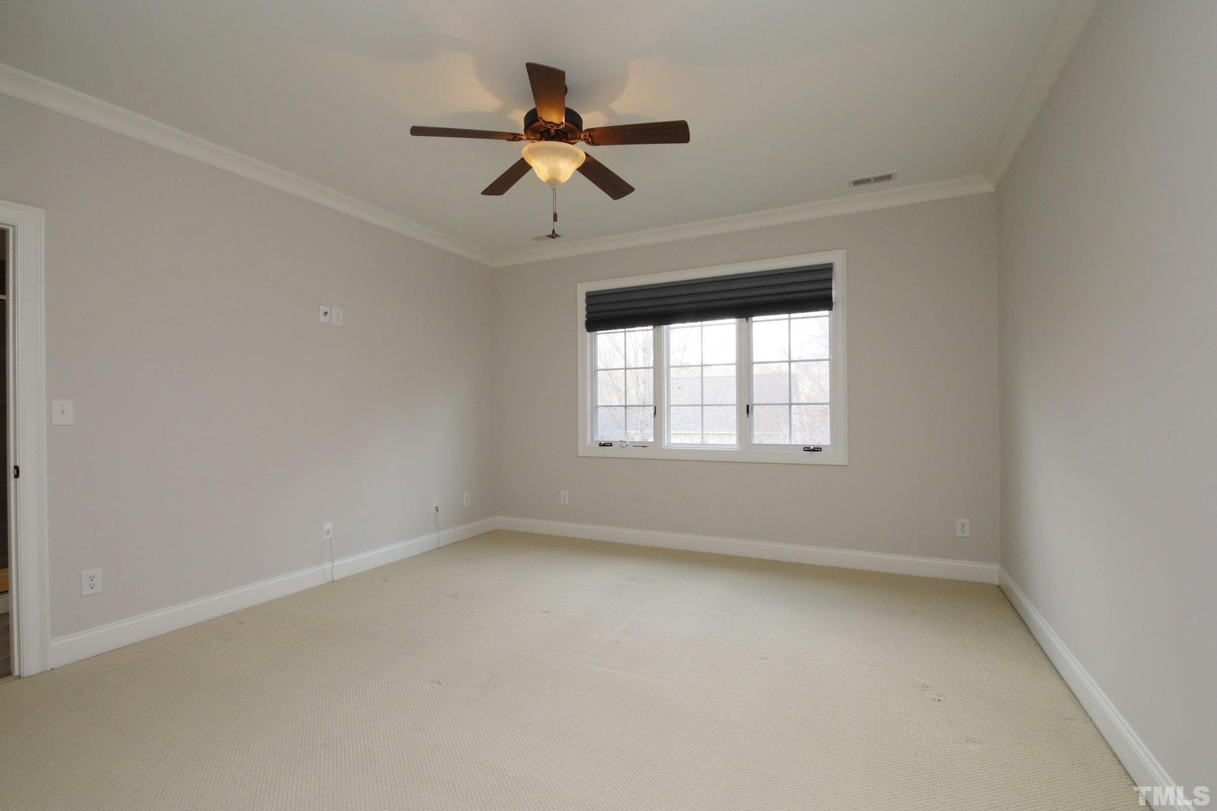 143 Cofield Circle Durham, NC 27707 - Photo 29 of 43 an empty room with a window and a fan