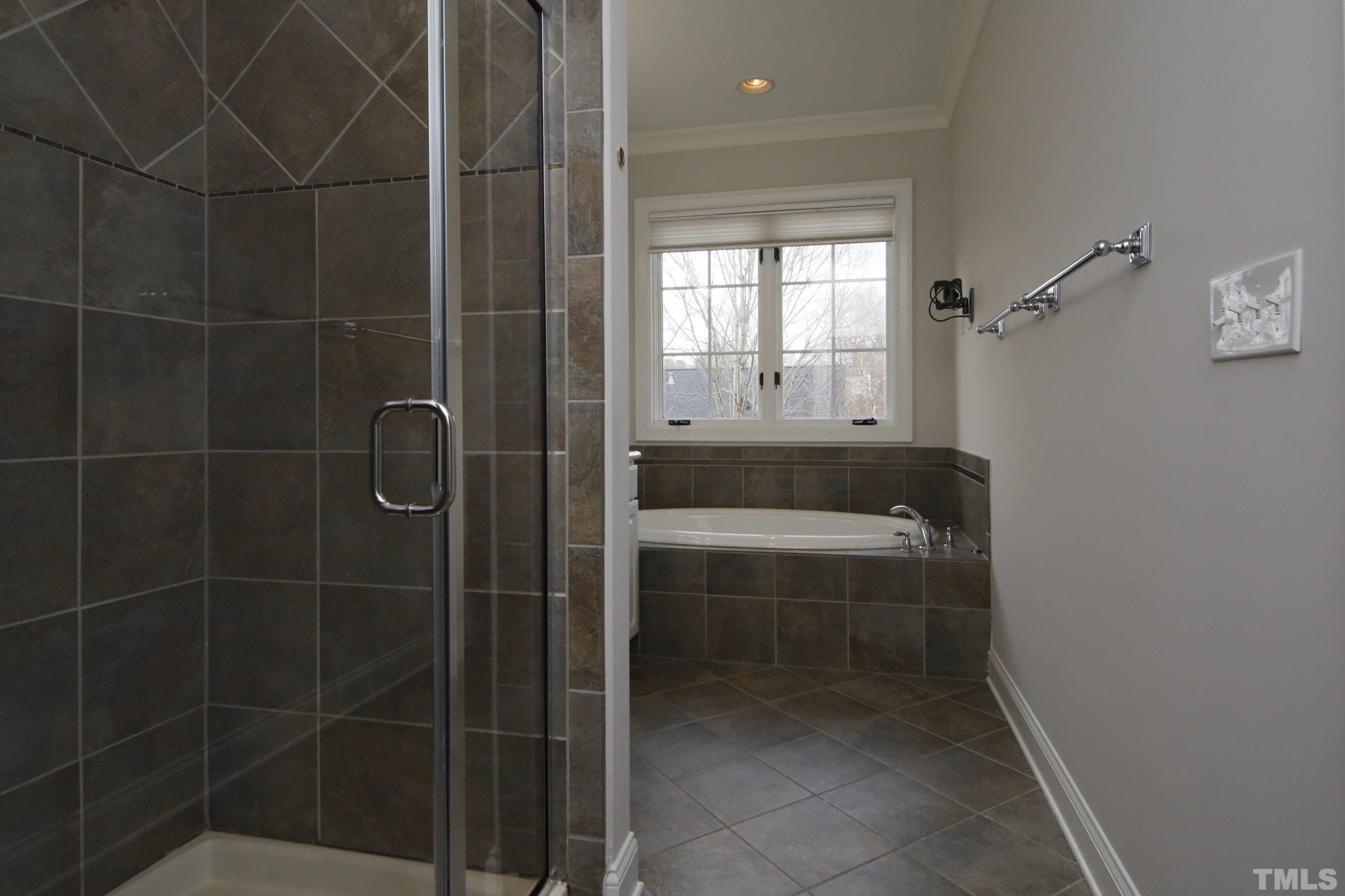 143 Cofield Circle Durham, NC 27707 - Photo 31 of 43 a bathroom with a bathtub and window