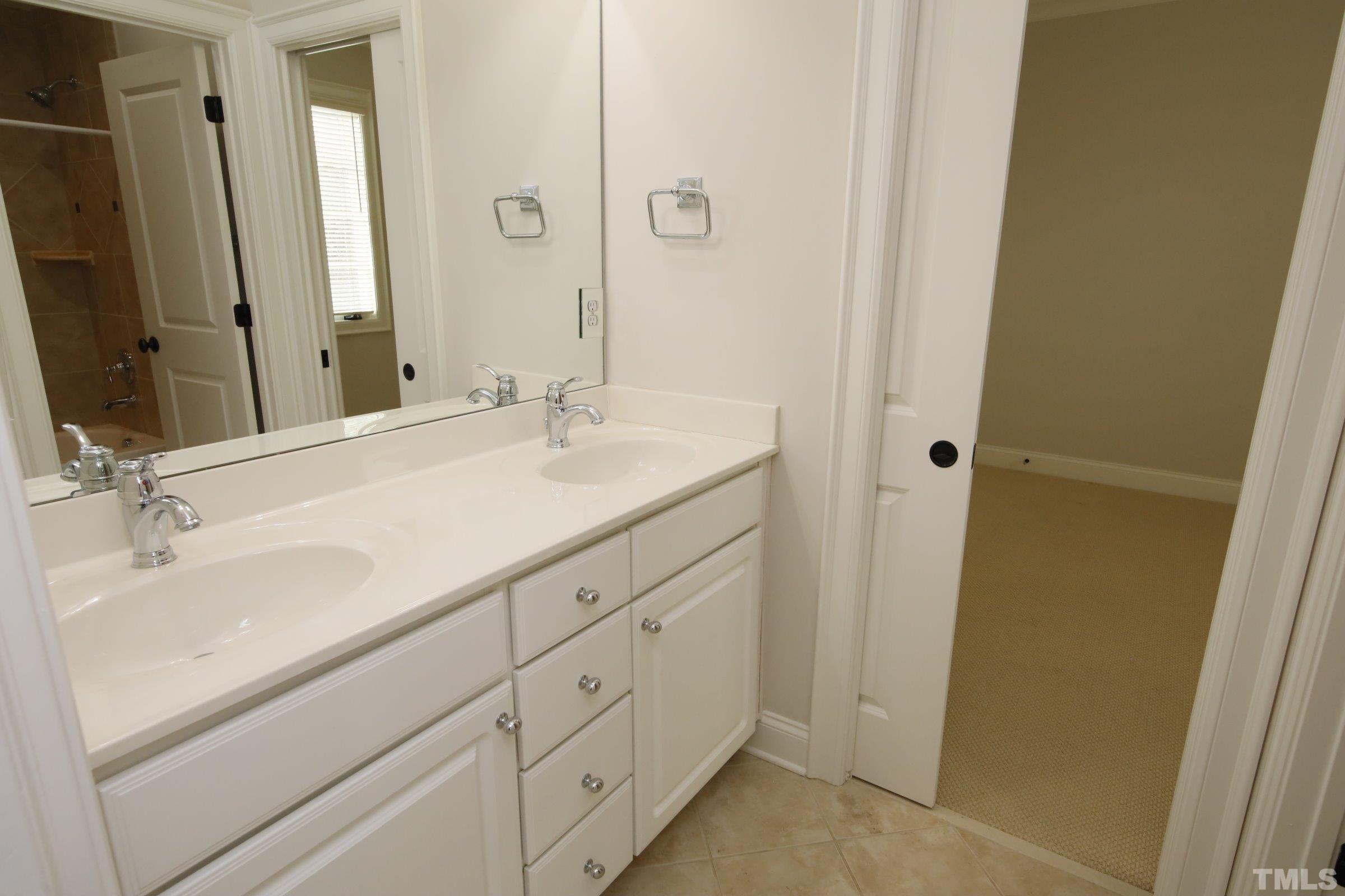 143 Cofield Circle Durham, NC 27707 - Photo 38 of 43 a bathroom with a sink and a mirror
