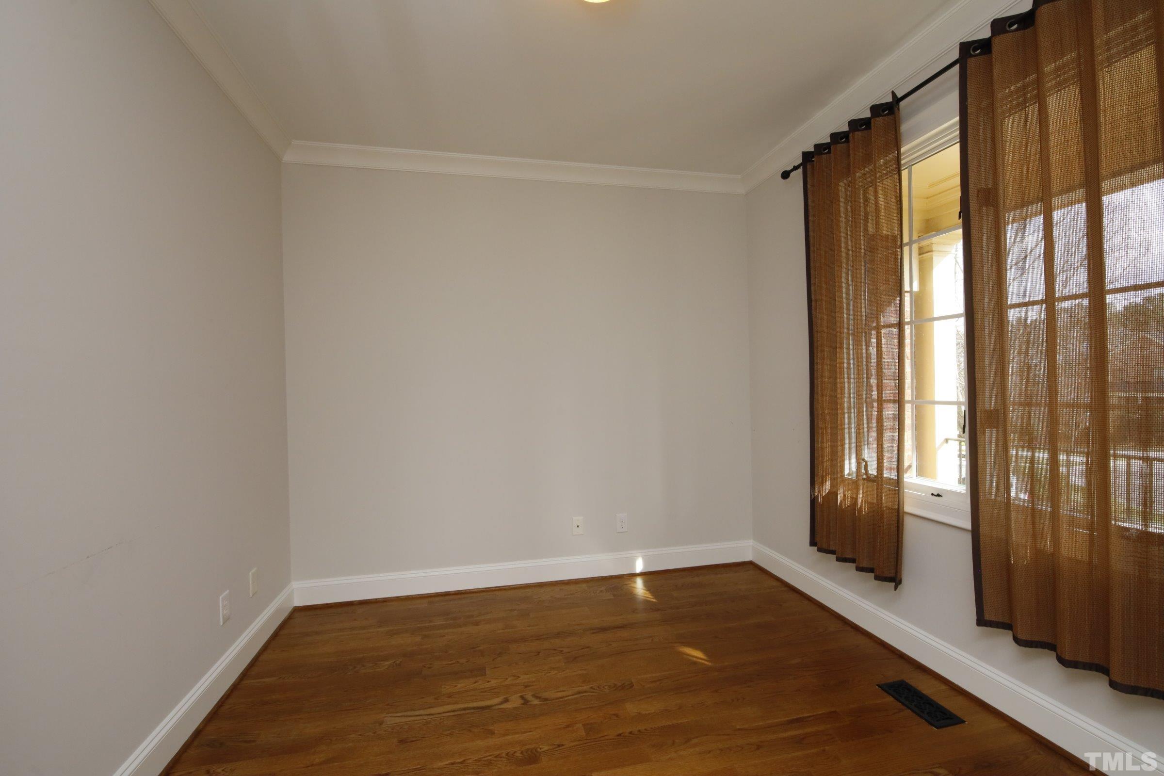 143 Cofield Circle Durham, NC 27707 - Photo 6 of 43 a view of an empty room with glass door