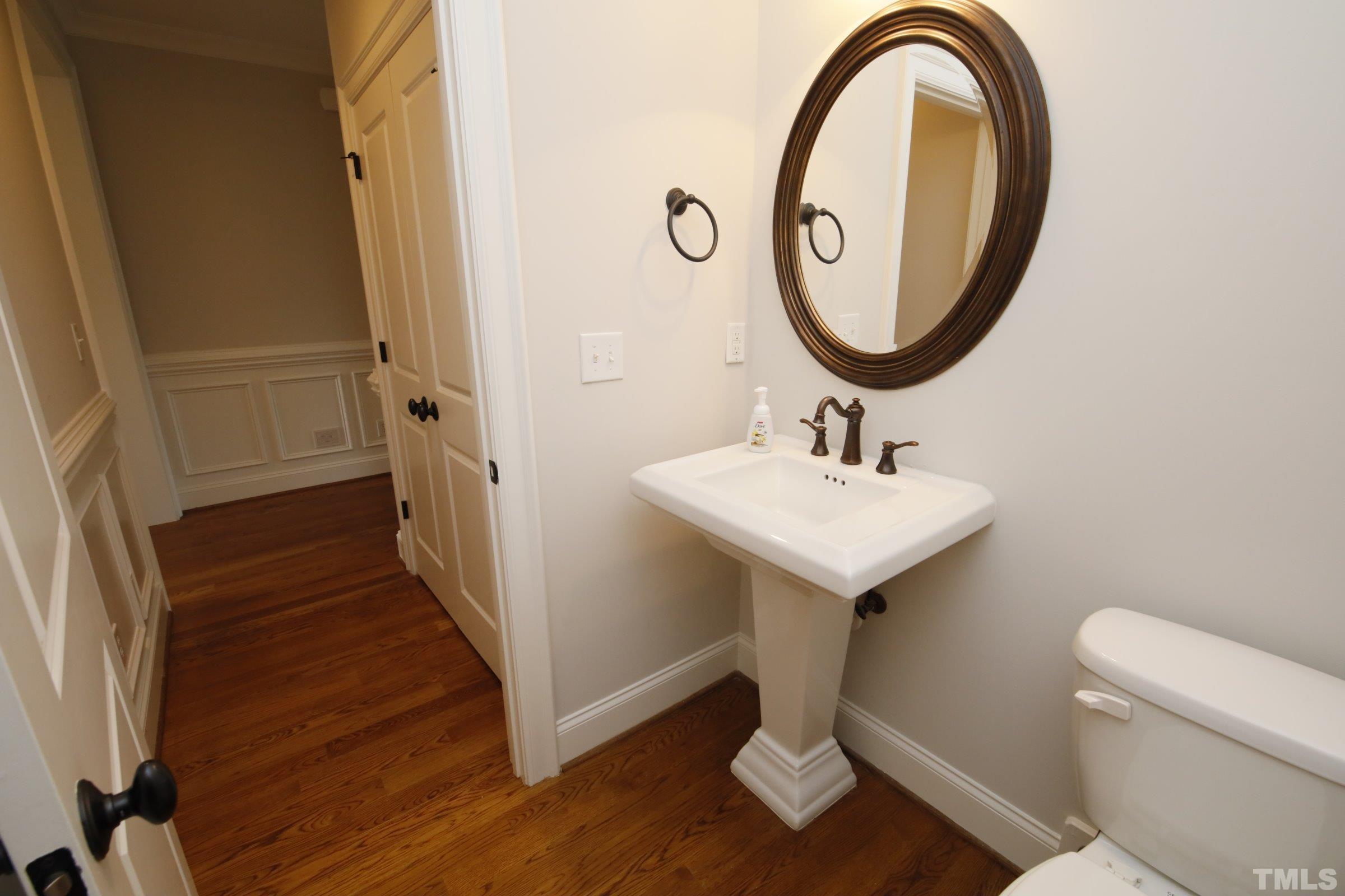 143 Cofield Circle Durham, NC 27707 - Photo 8 of 43 a bathroom with a sink and a mirror