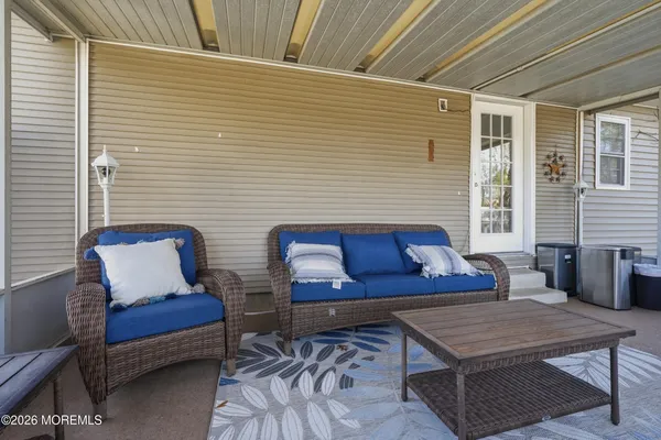a wooden bench sitting in front of a house