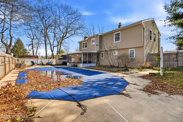 a front view of a house with swimming pool