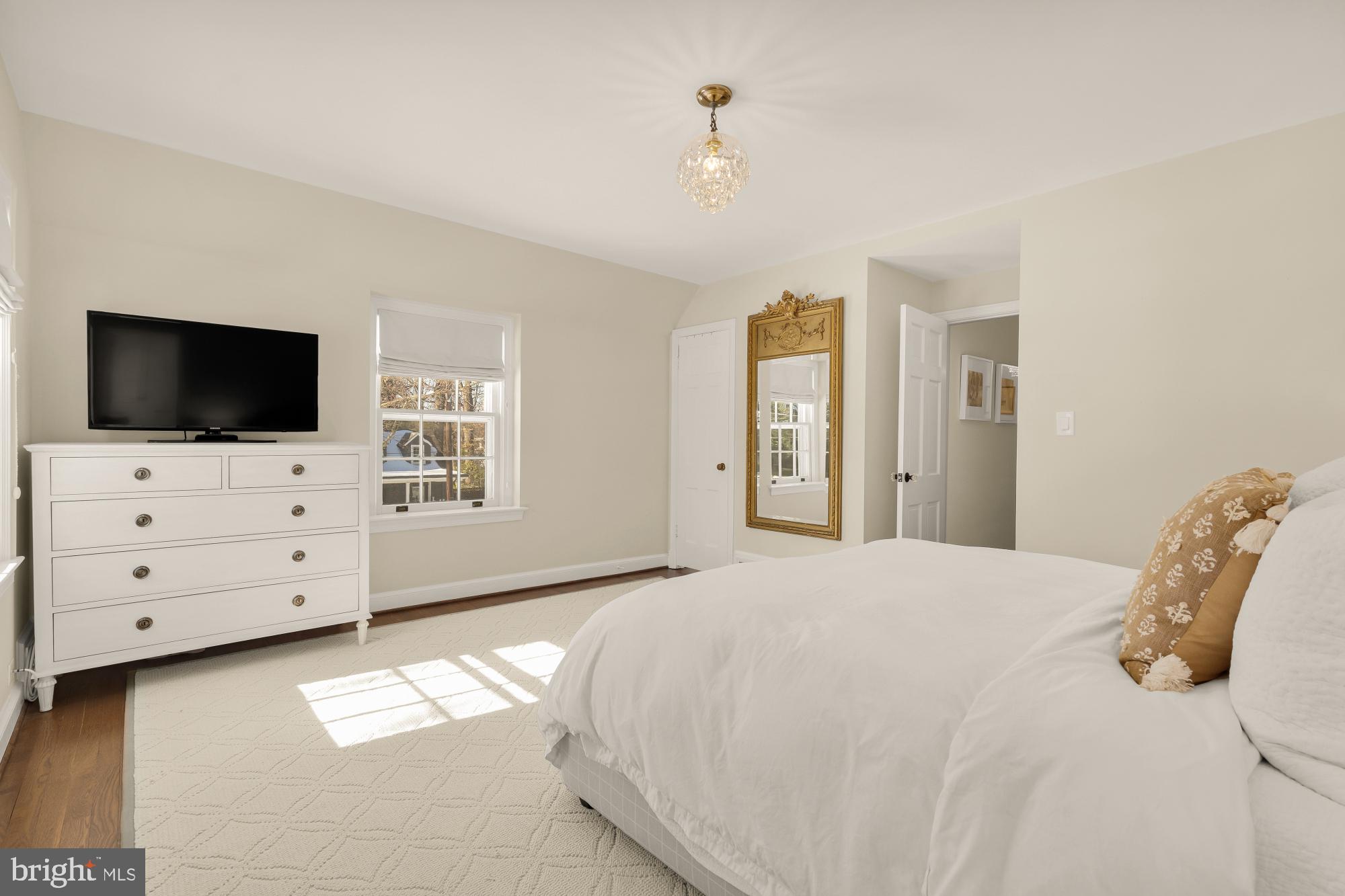 4501 47th Street Northwest Washington, DC 20016 - Photo 27 of 61 a bedroom with a bed and flat screen tv
