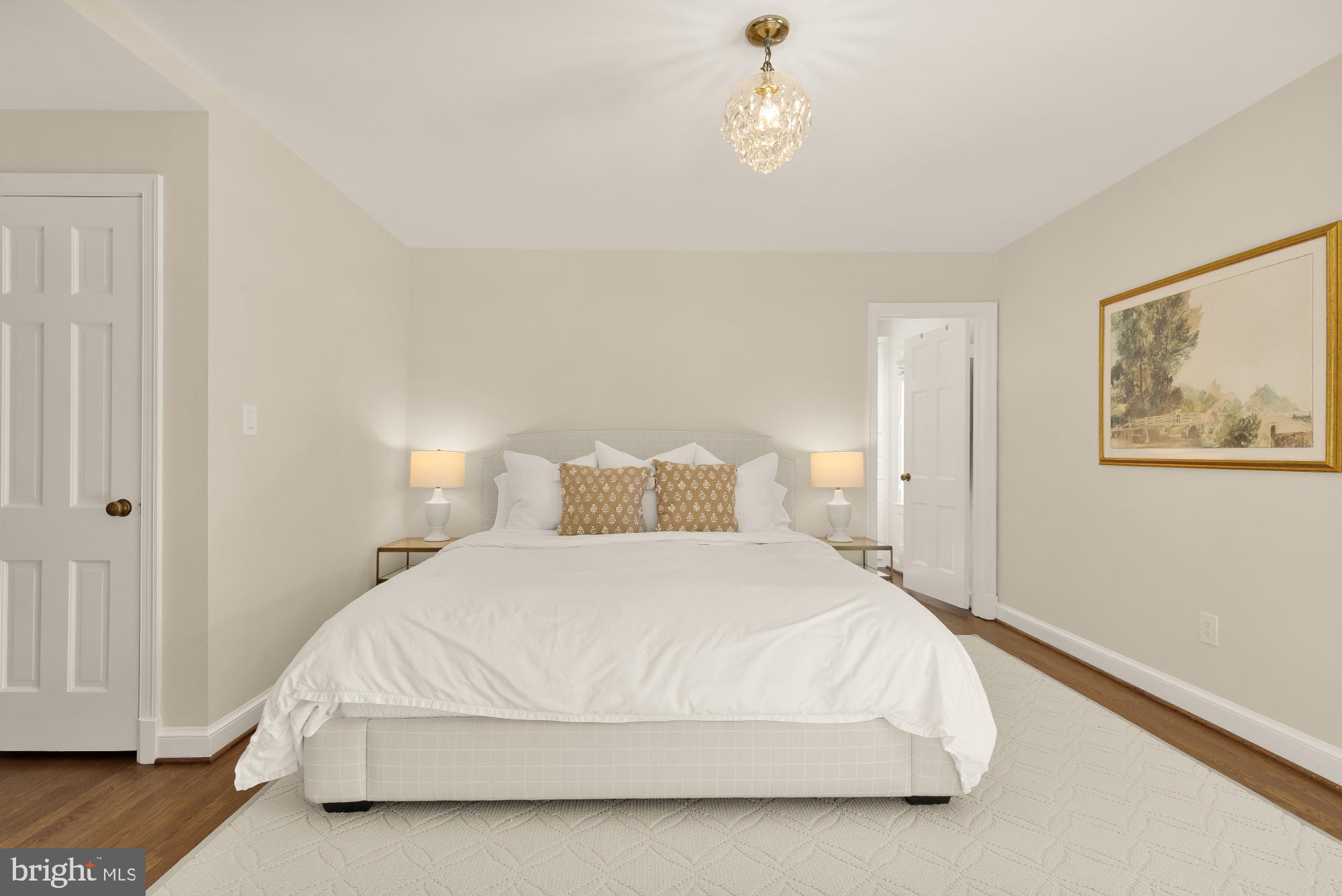 4501 47th Street Northwest Washington, DC 20016 - Photo 28 of 61 a spacious bedroom with a bed and wooden floor