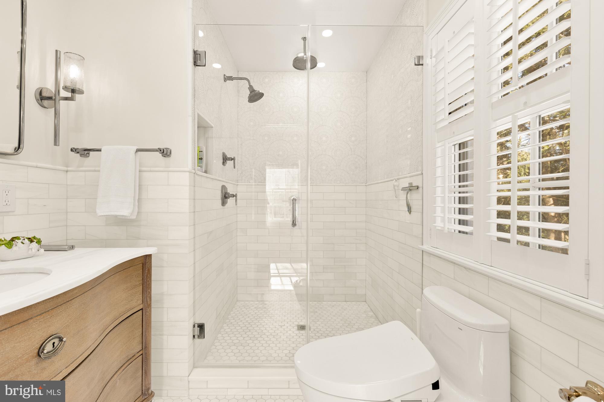 4501 47th Street Northwest Washington, DC 20016 - Photo 30 of 61 a bathroom with a sink toilet and shower