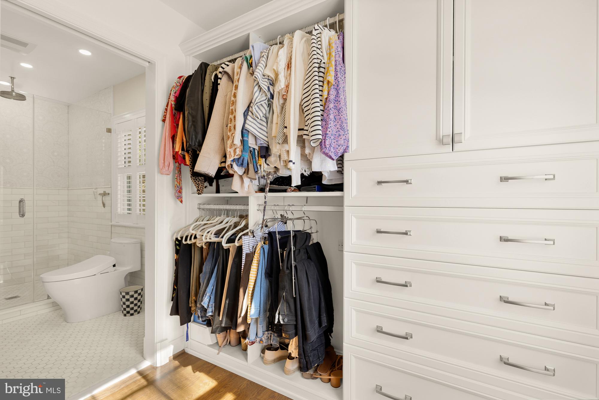 4501 47th Street Northwest Washington, DC 20016 - Photo 31 of 61 a view of walk in closet with clothes and shoes
