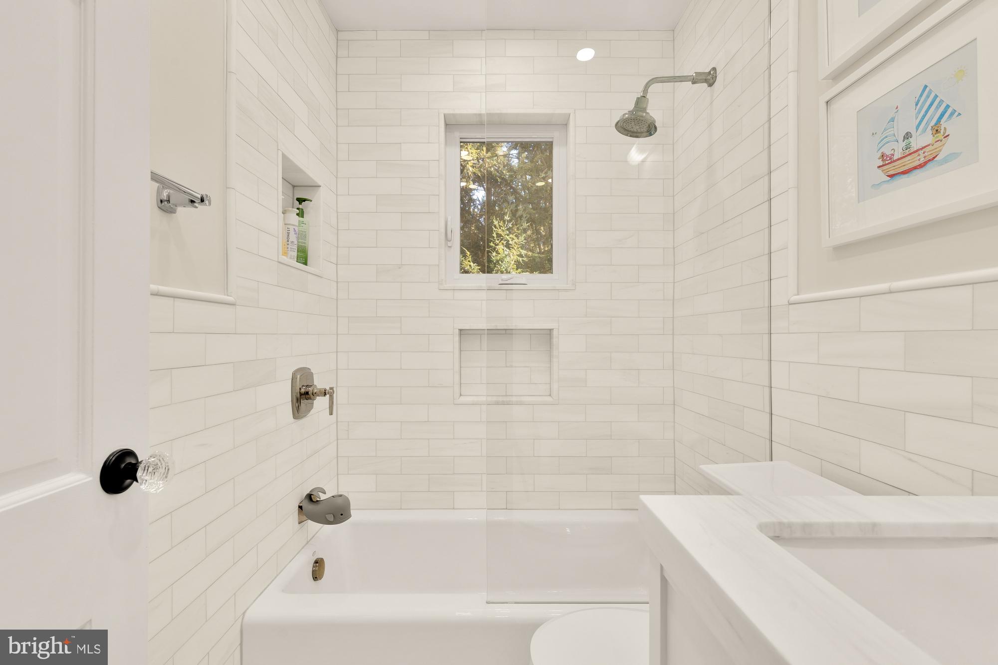 4501 47th Street Northwest Washington, DC 20016 - Photo 36 of 61 a bathroom with a bathtub and shower