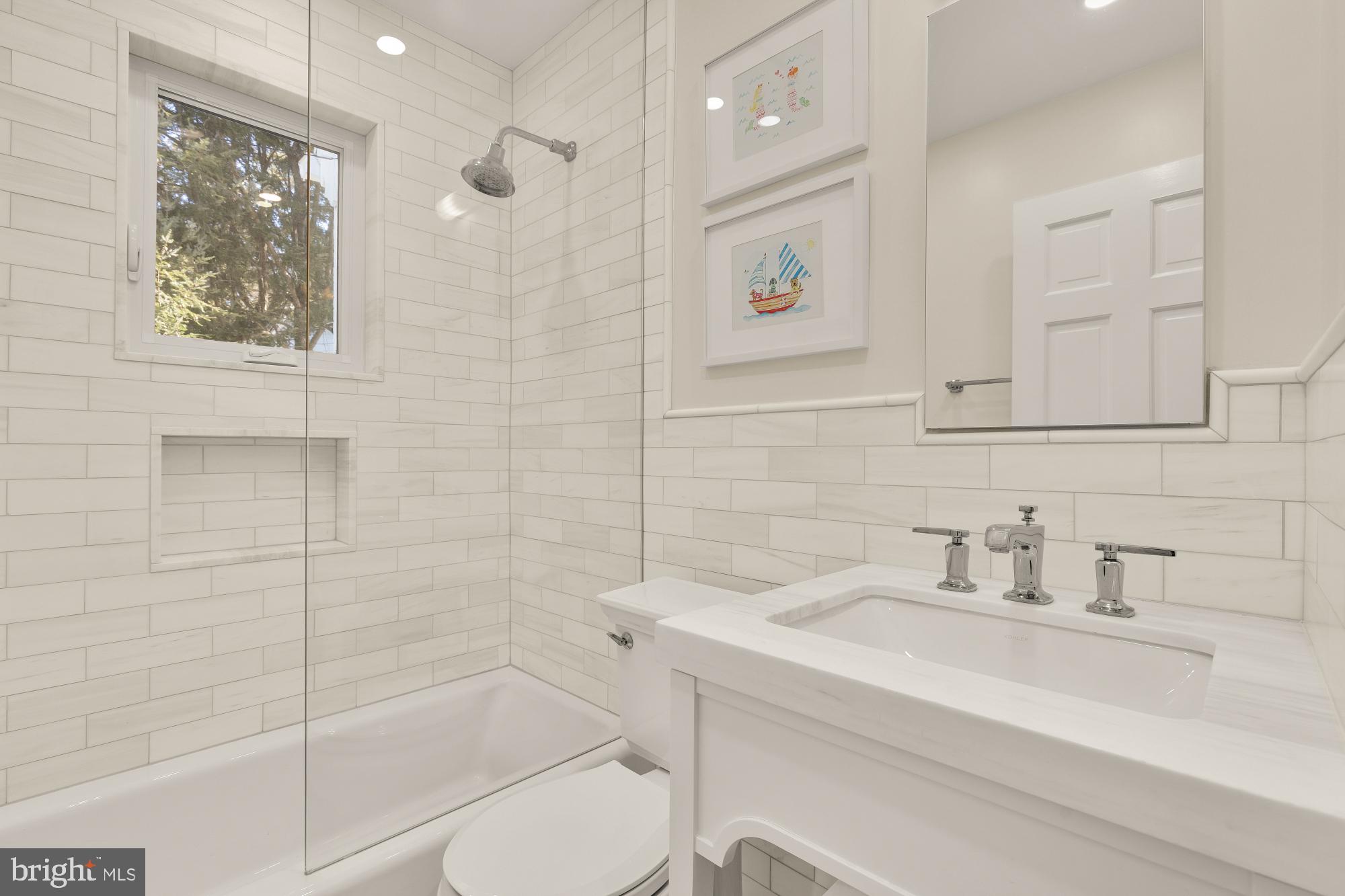 4501 47th Street Northwest Washington, DC 20016 - Photo 37 of 61 a bathroom with a sink shower and a mirror