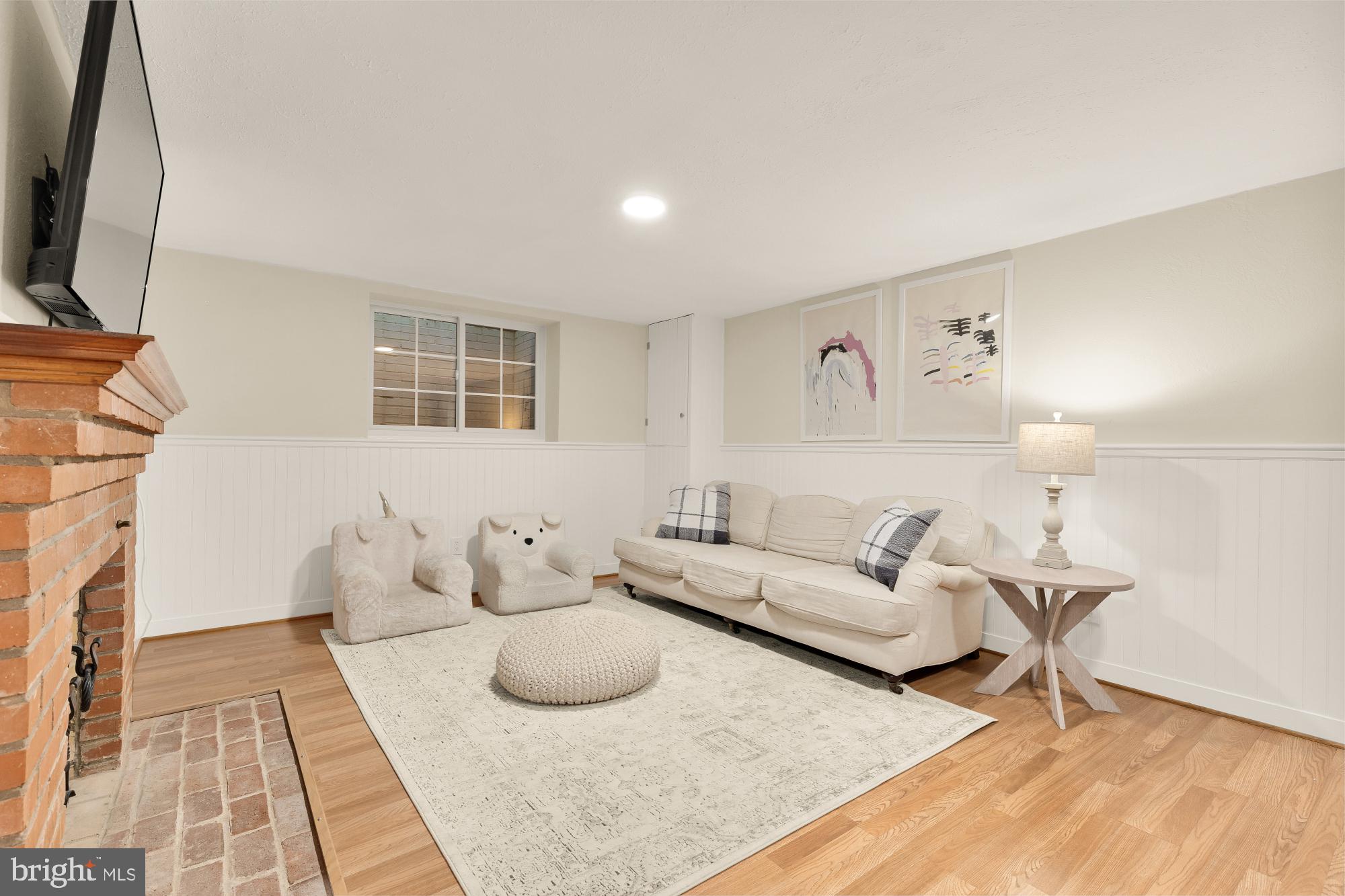 4501 47th Street Northwest Washington, DC 20016 - Photo 45 of 61 a living room with furniture and a fireplace
