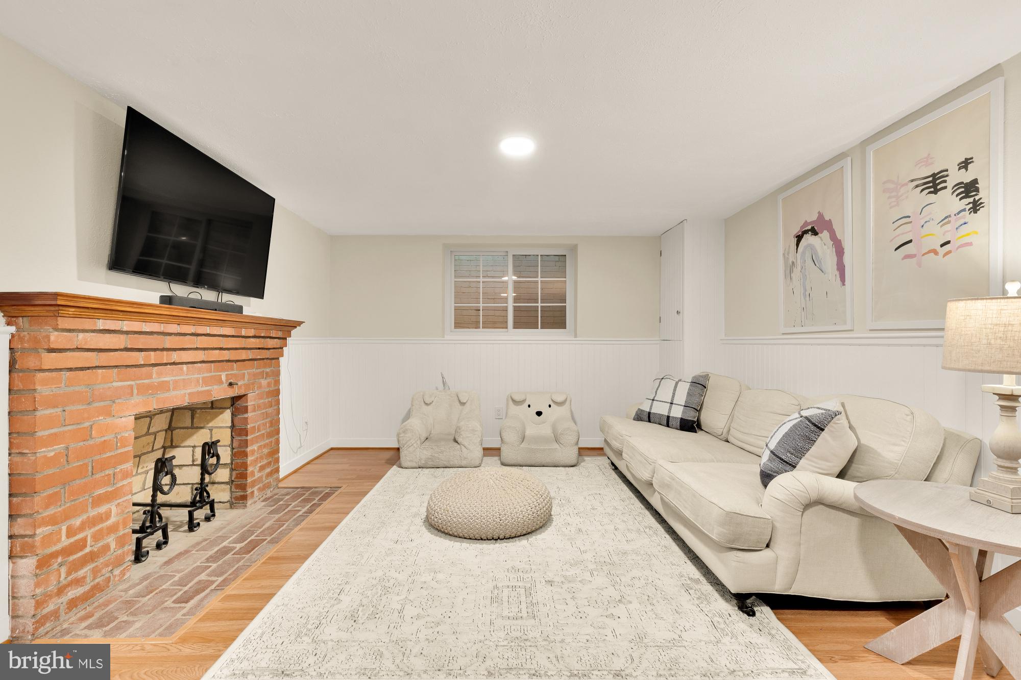 4501 47th Street Northwest Washington, DC 20016 - Photo 46 of 61 a living room with furniture and a flat screen tv