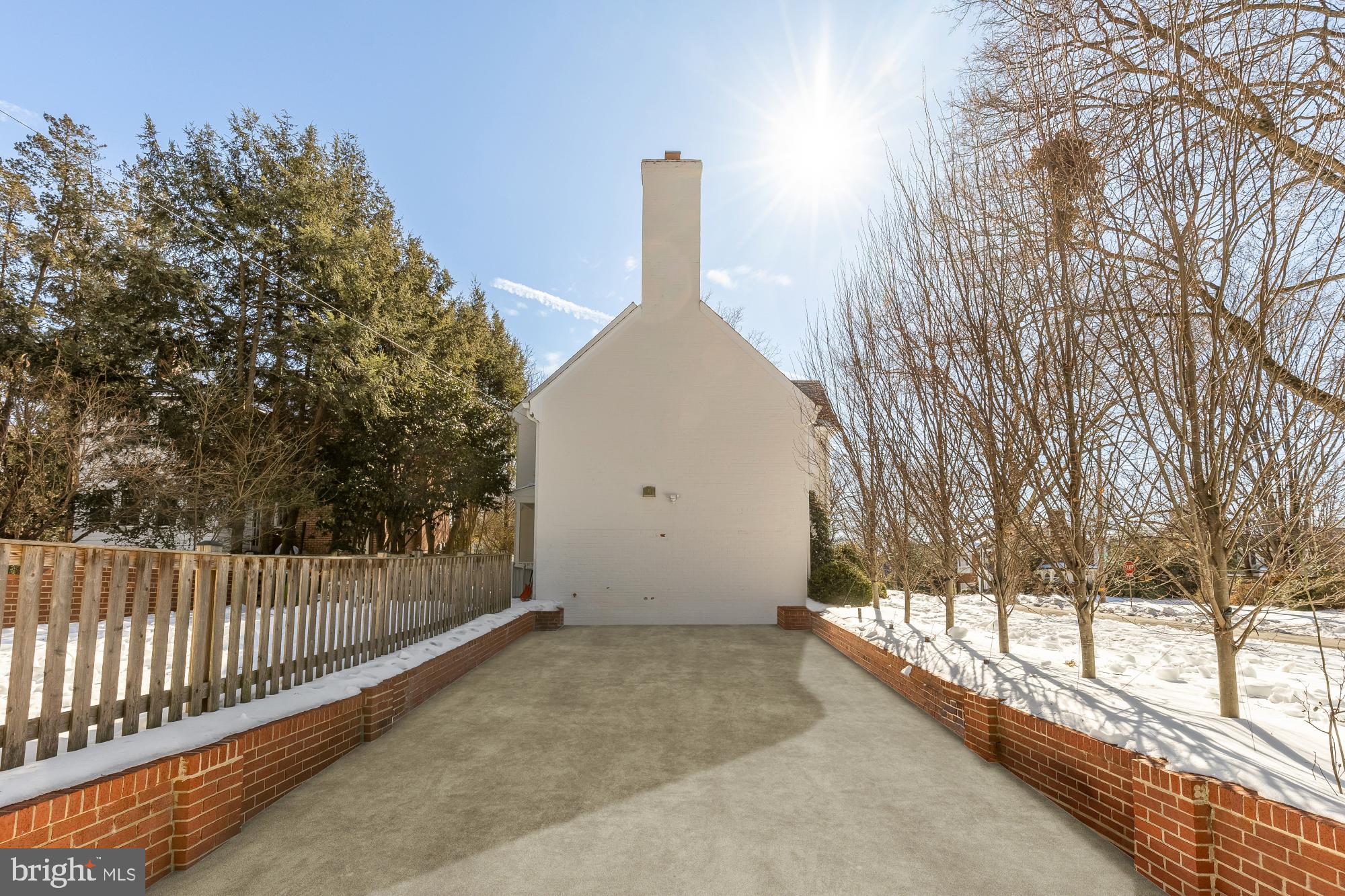 4501 47th Street Northwest Washington, DC 20016 - Photo 56 of 61 a view of a house with a small yard and a large tree